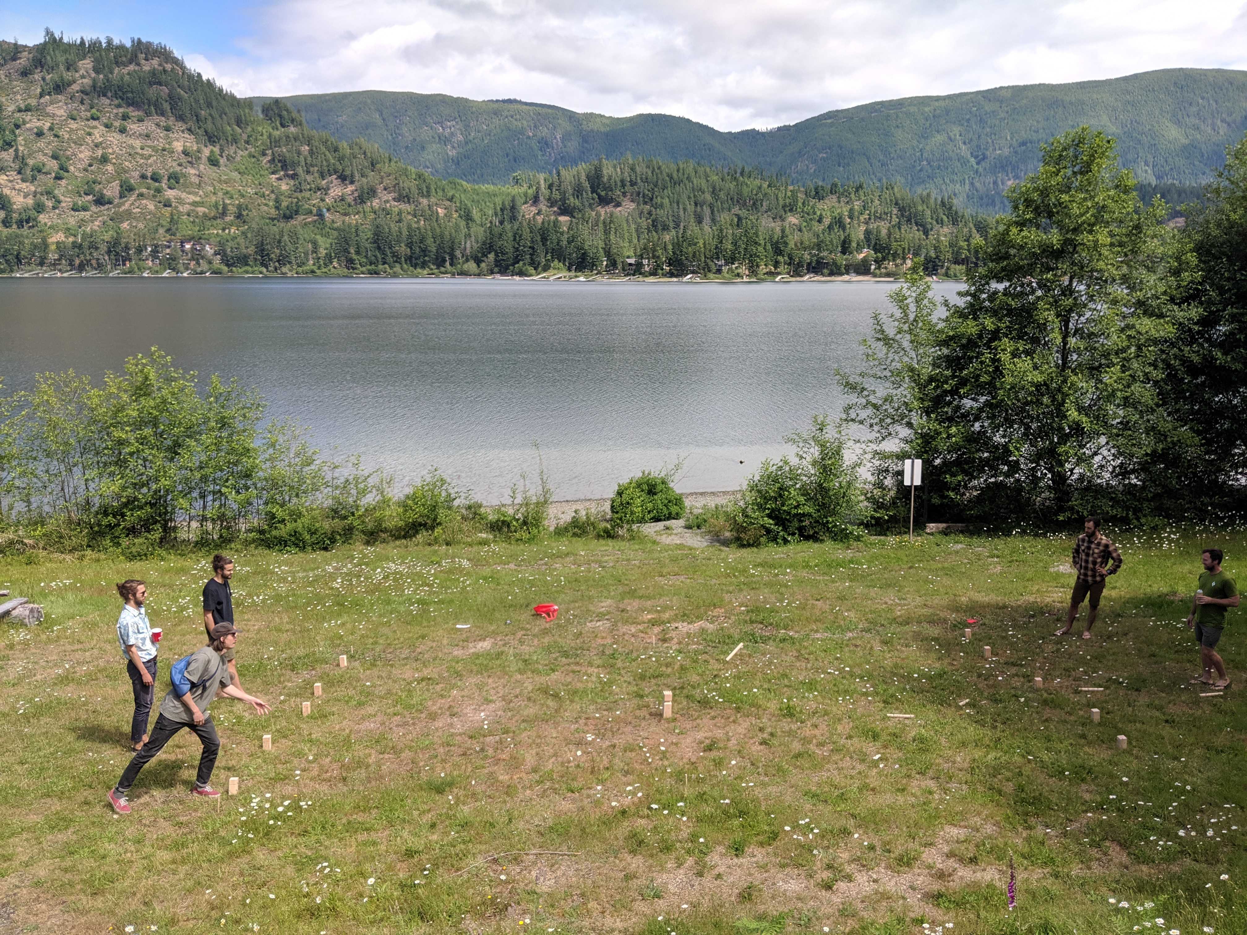 A relaxing game of kubb beside Lake Cowichan.